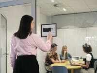 Screenshot of a Joan display for large conference rooms, also used for boardrooms, lobbies, and everywhere else an overview is needed. It offers a comprehensive overview of meetings, and current information for up to 9 rooms.